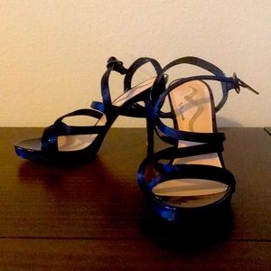 Navy blue strappy heals, only worn once, size 8